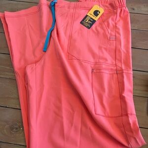 Carhartt Pink and Blue Wide Leg scrub pants.
